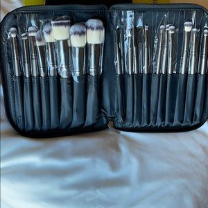 18 face brush set with a sleek black zip pouch
